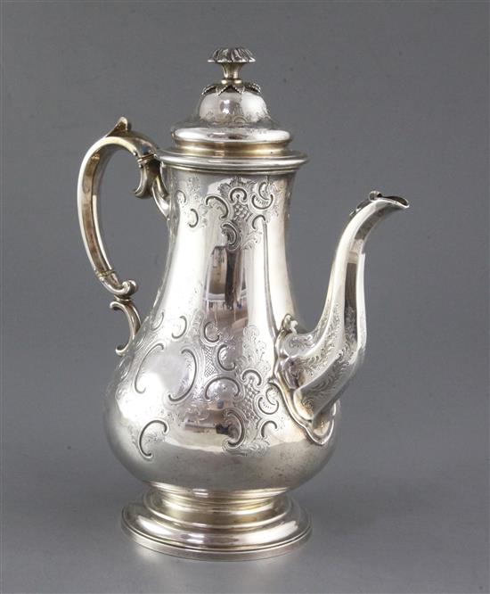An ornate early Victorian silver coffee pot by The Barnards, gross 30 oz.